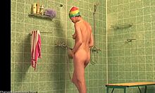 Colorful teen with long legs showering naked (voyeur video)